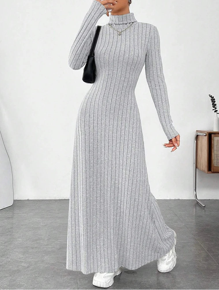 Woman wearing Vohran ribbed high-neck knit maxi dress with long sleeves and high neckline.