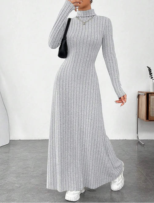 Woman wearing Vohran ribbed high-neck knit maxi dress with long sleeves and high neckline.