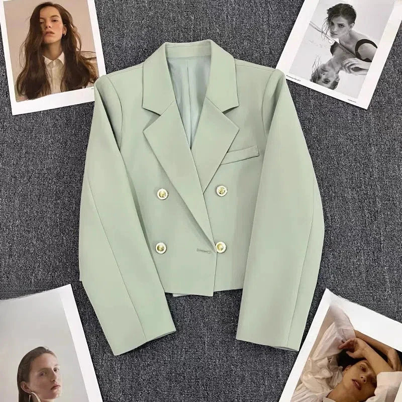 Elegant cropped double-breasted women’s blazer with tailored structure and metallic buttons by Vohran