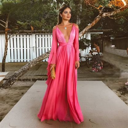 Deep V-neck maxi dress with flared sleeves and flowing silhouette, available in multiple colours – Vohran.