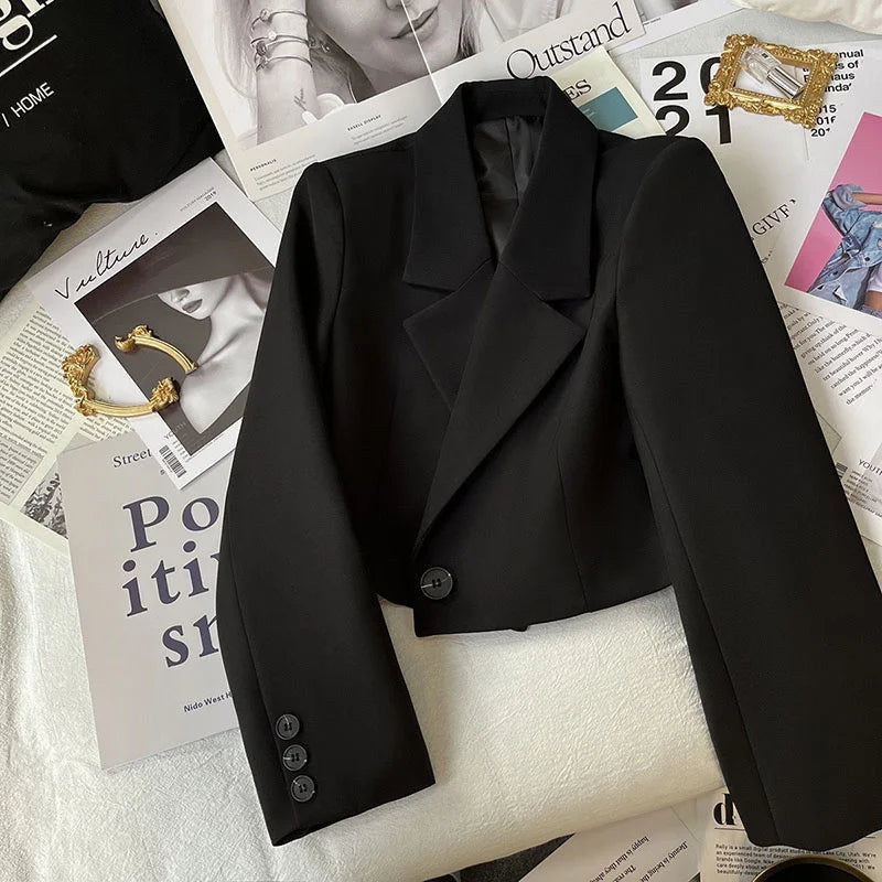 Cropped women’s blazer with double-breasted front, tailored lapels, and structured silhouette by Vohran