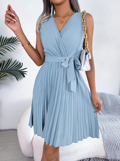 Sleeveless wrap pleated mini dress with waist tie and pleated skirt, available in multiple colours – Vohran.
