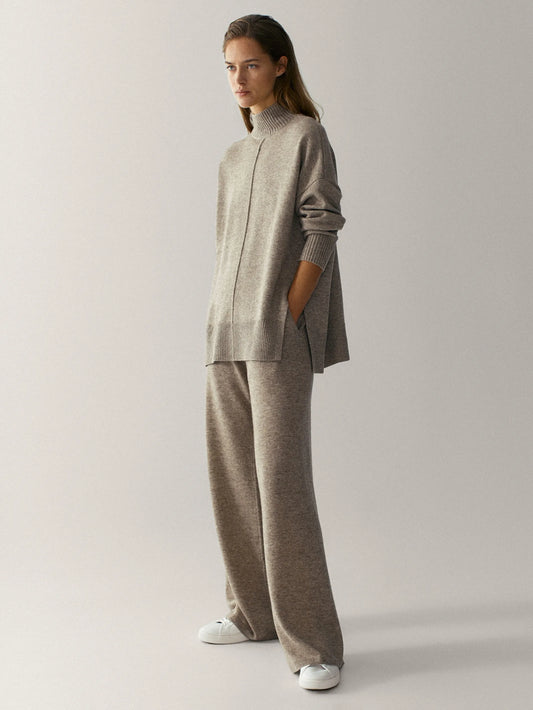 Minimalist wool-blend two-piece knitted set with oversized top and wide-leg trousers.
