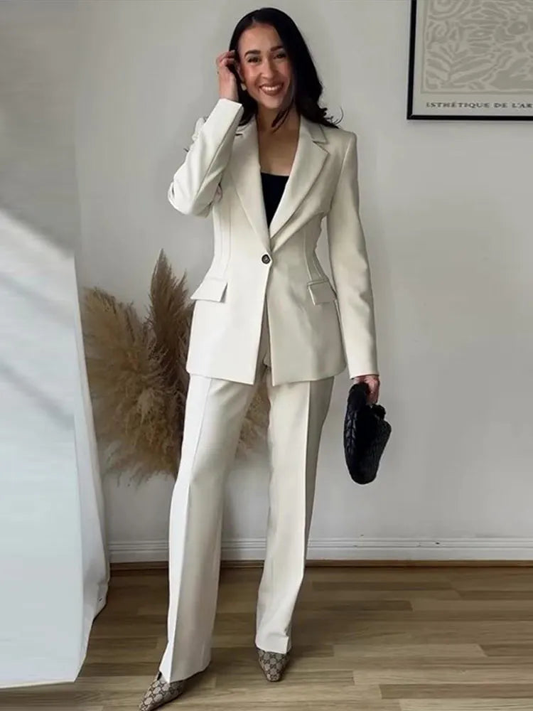 Elegant ivory women’s tailored blazer and trousers suit set for office or formal wear
