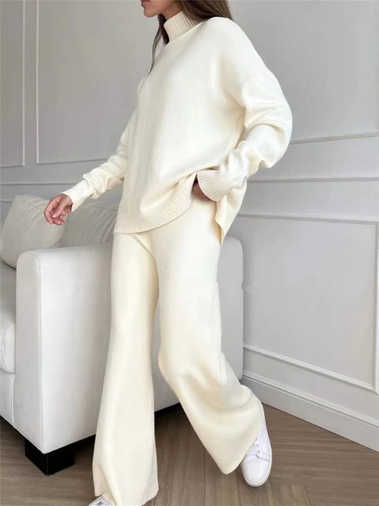 Knitted two-piece set with high-neck sweater and straight-leg trousers.