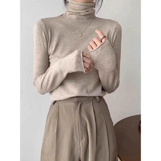 Elegant turtleneck knit pullover with long sleeves and ribbed edges