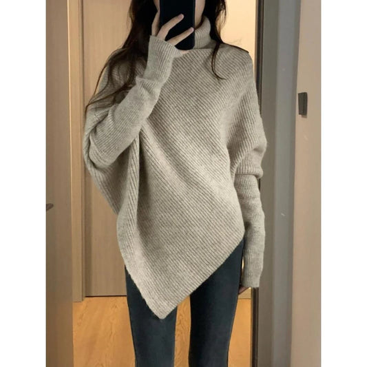 Loose turtleneck knit sweater with batwing sleeves and asymmetrical contour