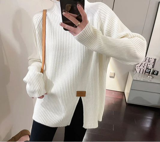 Soft ribbed knit pullover sweater with long sleeves and classic neckline