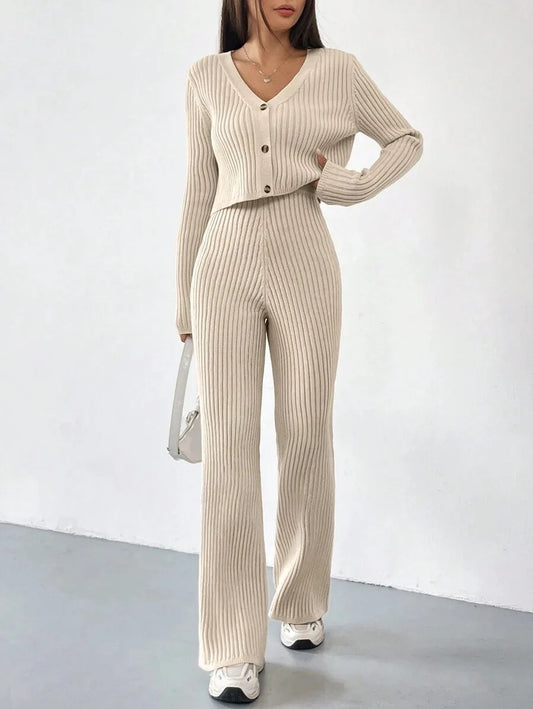 Ribbed knit co-ord with V-neck button cardigan and flared trousers on model